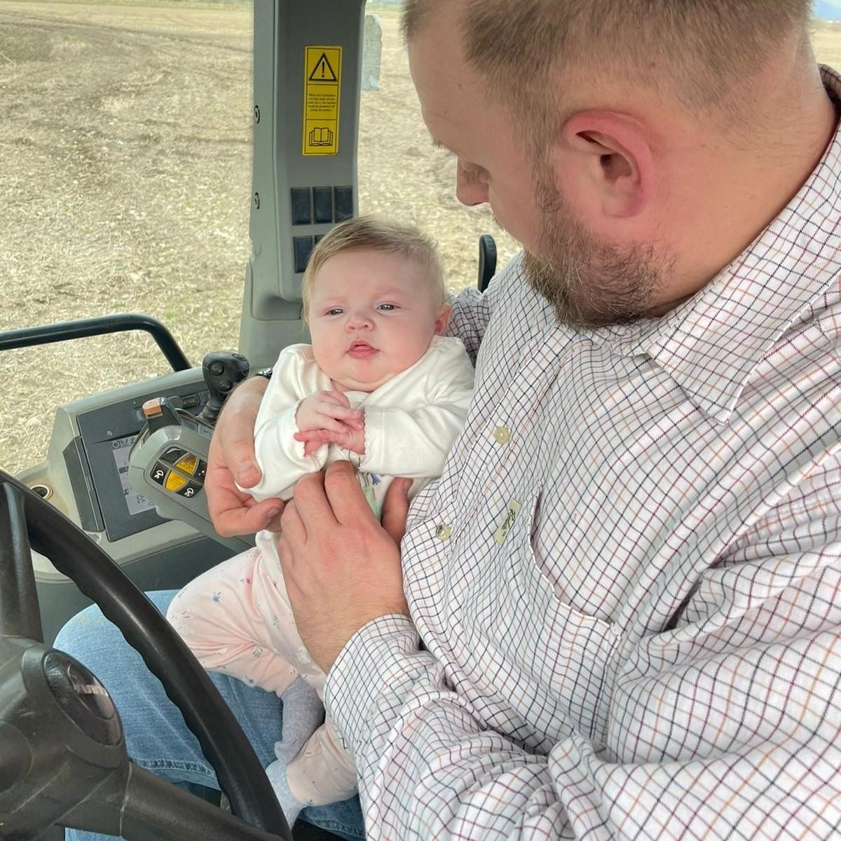 Emma Kinross - 11 week old Mirren Blennie in the tractor for the first time with her dad Robert Blennie