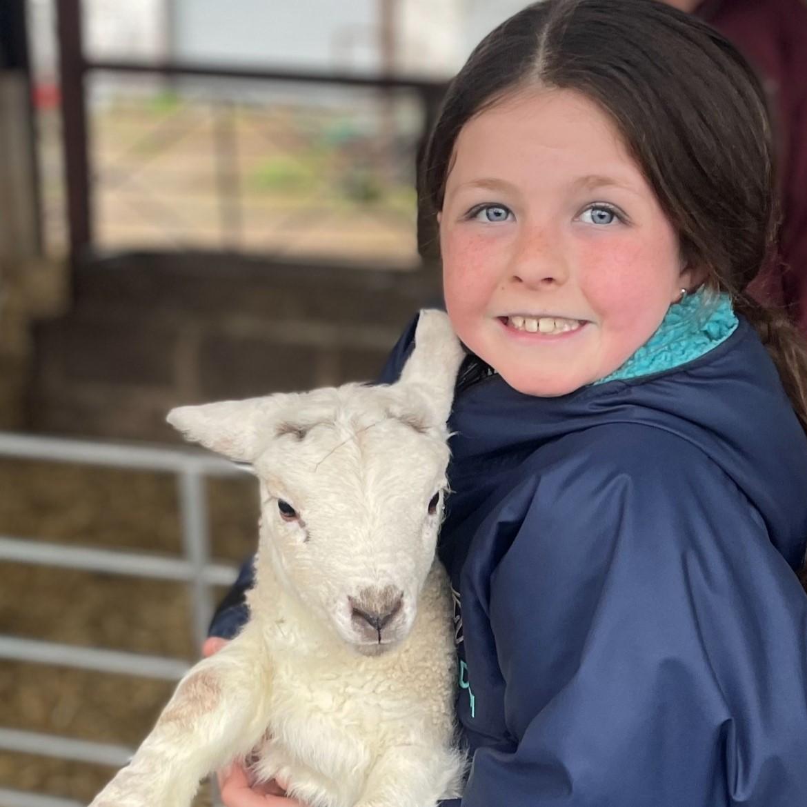 Jacqueline McInally - This is Jessica aged 10 with her namesake Jessica the lamb. Jessica the lamb is the first lamb she has ever delivered.
