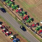 Scottish farmers formed a guard of honour with their tractors as The Queen made her last journey through the Aberdeenshire countryside (Pic: ITV)