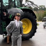 A Dorset student has amassed millions of views for a video showing him arriving at his school prom in a tractor convoy.