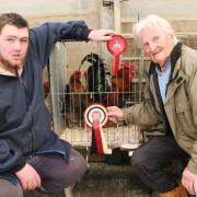 Ethan Healey, left, with his Craven Feather Auction Welsummer champions, joined by judge William Gregson