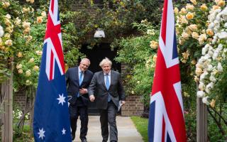 Prime Minister Boris Johnson with Australian Prime Minister Scott Morrison in the garden of 10 Downing Street, London, after agreeing the broad terms of a free trade deal between the UK and Australia, the UK's first trade deal negotiated fully since