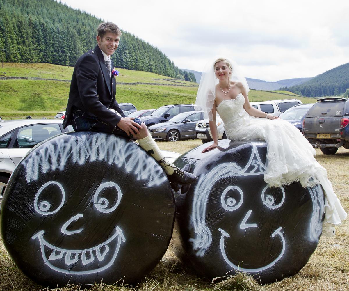 Colin Dick, Hamildean Farm, Peebles, married Lee Thornborrow, Easter Dawyck, Stobo, at Teedsmuir Church. Colin's cousin Richard Wood had baled the field to be used for car park and painted the bales with a happy couple theme