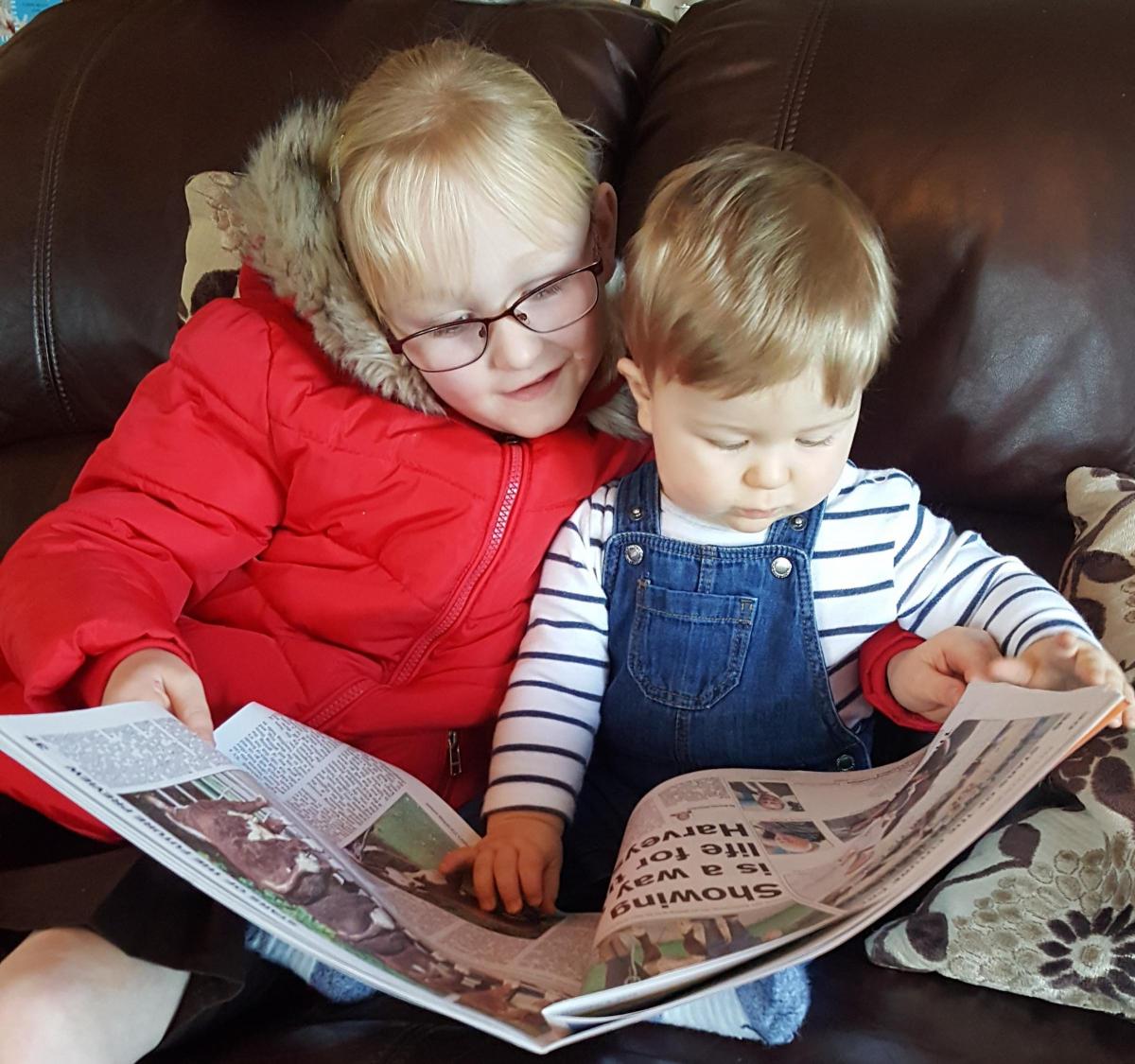 Basil Watt, aged 10 months, and Hannah Watt, aged six years take time to teach each other about Scotland's farming landscape, while at home in Tarboltin in South Ayrshire